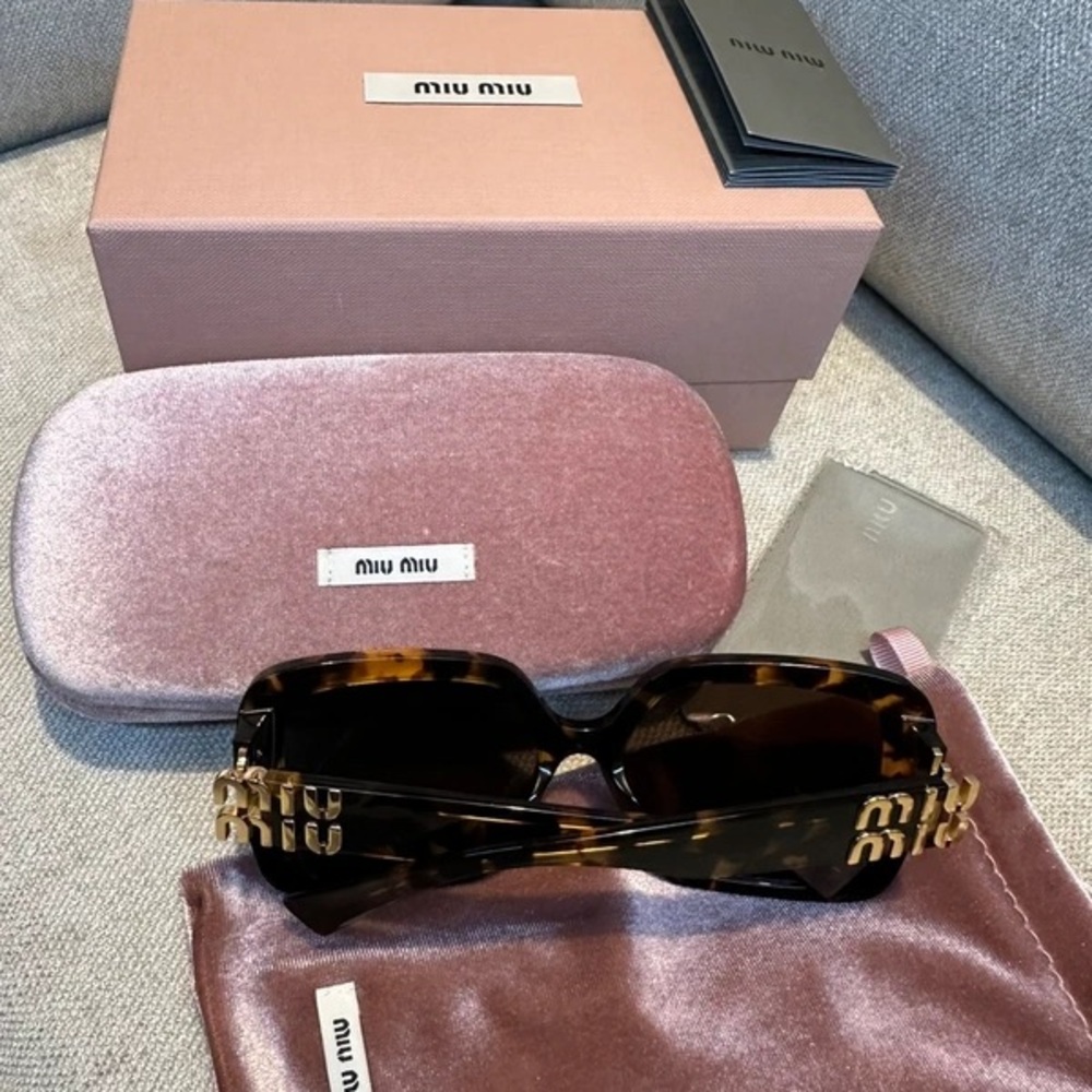 Miu Miu Tortoise Shell Sunglasses with Gold Detailing